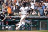 Detroit Tigers' Eric Haase, right, rounds third base on his three run inside-the-park home run in the fourth inning of a baseball game against the Chicago White Sox in Detroit, Saturday, July 3, 2021. (AP Photo/Paul Sancya)