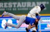 Chicago Cubs shortstop Javier Baez, below, forces out Milwaukee Brewers center fielder Jackie Bradley Jr. at second base during the second inning of a baseball game Wednesday, June 30, 2021, in Milwaukee. (AP Photo/Jeffrey Phelps)