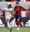 Los Angeles FC defender Eddie Segura, left, heads the ball away from Real Salt Lake midfielder Damir Kreilach during an MLS soccer match in Sandy, Utah, Saturday, July 3, 2021. (Scott G Winterton/The Deseret News via AP)