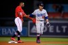 Los Angeles Dodgers right fielder Mookie Betts (50) and Washington Nationals' Victor Robles (16) smile after Robles was tagged out trying to steal second during the seventh inning of a baseball game, Saturday, July 3, 2021, in Washington. Robles was originally called safe, but was ruled out after review. The Dodgers won 5-3. (AP Photo/Nick Wass)