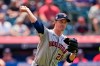 Houston Astros starting pitcher Zack Greinke throws out Cleveland Indians' Roberto Perez at first base after Perez bunted in the fifth inning of a baseball game, Sunday, July 4, 2021, in Cleveland. (AP Photo/Tony Dejak)