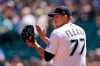 Seattle Mariners starting pitcher Chris Flexen applauds teammates on a third out play against the Texas Rangers to end the top of the second inning of a baseball game Sunday, July 4, 2021, in Seattle. (AP Photo/Elaine Thompson)