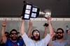 FILE - In this June 13, 2012, file photo, Norfolk Admirals captain Mike Angelidis lifts the Calder Cup over his head at Scope Plaza after the conclusion of the parade through downtown Norfolk, Va. Jon Cooper is one victory by his Tampa Bay Lightning away from becoming just the second coach in the NHL's salary-cap era to win the Stanley Cup in back-to-back seasons. Cooper also won the American Hockey League's Calder Cup in 2012 with Norfolk after going on a 28-game winning streak during the season. (Sean Proctor/The Virginian-Pilot via AP, File)
