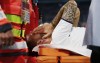 Italy's Leonardo Spinazzola covers his face after injuring during the Euro 2020 soccer championship quarterfinal match between Belgium and Italy at at the Allianz Arena in Munich, Germany, Friday, July 2, 2021. (AP Photo/Philipp Guelland, Pool Photo via AP)