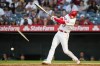 Los Angeles Angels designated hitter Shohei Ohtani (17) breaks a bat during the third inning of a baseball game against the Boston Red Sox Monday, July 5, 2021, in Anaheim, Calif. He was safe at first after grounding in to a forced out. David Fletcher was out at second. (AP Photo/Ashley Landis)