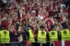 Security watch over Danish fans during the Euro 2020 soccer championship quarterfinal match between Czech Republic and Denmark, at the Olympic stadium in Baku, Saturday, July 3, 2021. (AP Photo/Darko Vojinovic, Pool)