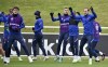 England's Harry Kane, right, warms-up with teammates during a training session at St George's Park, Burton upon Trent, England, Tuesday July 6, 2021, ahead of their Euro 2020 soccer championship semifinal match against Denmark in London on Wednesday. (AP Photo/Rui Vieira)