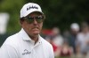 Phil Mickelson reacts after missing a putt on the ninth green during the final round of the Travelers Championship golf tournament at TPC River Highlands, Sunday, June 27, 2021, in Cromwell, Conn. (AP Photo/John Minchillo)