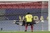 Argentina's goalkeeper Emiliano Martinez, back, stops a penalty shot by Colombia's Yerry Mina in a the penalty shootout during a Copa America semifinal soccer match at the National stadium in Brasilia, Brazil, Wednesday, July 7, 2021. (AP Photo/Eraldo Peres)