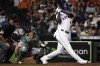 Houston Astros' Yordan Alvarez, right, hits a three-run home run during the fifth inning of a baseball game against the Oakland Athletics, Tuesday, July 6, 2021, in Houston. (AP Photo/Eric Christian Smith)
