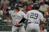 New York Yankees' Rougned Odor, left, celebrates with Gio Urshela (29) after Odor hit a three-run home run during the eighth inning of the team's baseball game against the Seattle Mariners, Tuesday, July 6, 2021, in Seattle. (AP Photo/Ted S. Warren)