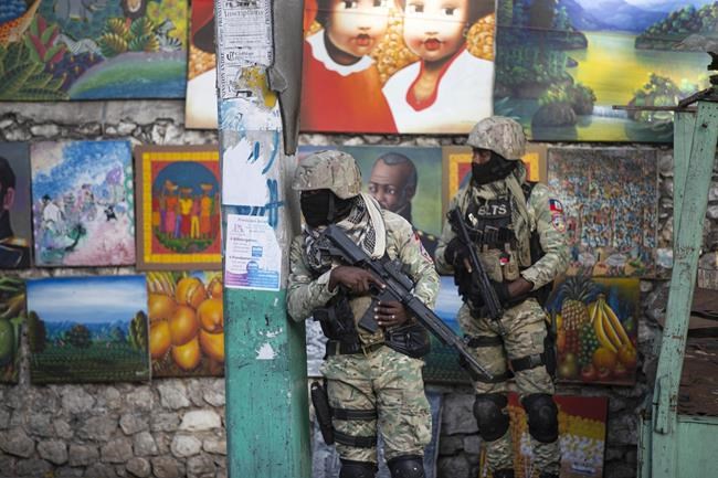 Soldiers patrol in Petion Ville, the neighborhood where the late Haitian President Jovenel Moise lived in Port-au-Prince, Haiti, Wednesday, July 7, 2021. Moïse was assassinated in an attack on his private residence early Wednesday, and First Lady Martine Moïse was shot in the overnight attack and hospitalized, according to a statement from the country’s interim prime minister. (AP Photo/Joseph Odelyn)