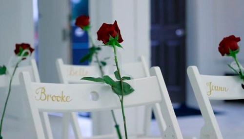 FILE - In this Nov. 12, 2017 file photo, a memorial for the victims of the shooting at Sutherland Springs Baptist Church includes 26 white chairs, each painted with a cross and and rose and placed in the sanctuary, in Sutherland Springs, Texas. A federal judge ruled Wednesday, July 7, 2021, the U.S. Air Force was 