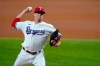 Texas Rangers starting pitcher Kyle Gibson throws to the Detroit Tigers in the first inning of a baseball game in Arlington, Texas, Wednesday, July 7, 2021. (AP Photo/Tony Gutierrez)