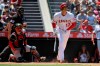 Los Angeles Angels' Shohei Ohtani, right, heads to first after hitting a solo home run as Boston Red Sox catcher Christian Vazquez, center, and home plate umpire Adam Beck watch during the fifth inning of a baseball game Wednesday, July 7, 2021, in Anaheim, Calif. (AP Photo/Mark J. Terrill)