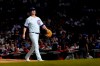 Chicago Cubs starting pitcher Alec Mills leaves the baseball game during the sixth inning against the Philadelphia Phillies on Wednesday, July 7, 2021, in Chicago. (AP Photo/Charles Rex Arbogast)