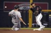 Arizona Diamondbacks second baseman Eduardo Escobar turns the double play while avoiding Colorado Rockies' C.J. Cron (25) on a ball hit by Elias Diaz during the fourth inning during a baseball game Wednesday, July 7, 2021, in Phoenix. (AP Photo/Rick Scuteri)