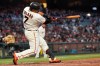 San Francisco Giants' Donovan Solano breaks his bat hitting an RBI-double against the St. Louis Cardinals during the fifth inning of a baseball game in San Francisco, Wednesday, July 7, 2021. (AP Photo/Jeff Chiu)