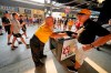 Tom Congdon, left center, a vendor at Pittsburgh sports venues for 38 years, mans his beer and water cart in the concourse at PNC Park during a baseball game between the Pittsburgh Pirates and the Atlanta Braves in Pittsburgh, Monday, July 5, 2021. It would be premature to say that the scene at major league ballparks has completely returned to normal, but there’s no question this season has been a step in that direction — perhaps most crucially for the people who work there. With fans back in the stands and concessions being sold, ballpark employees have had a chance to return after the pandemic hit many of them hard. (AP Photo/Gene J. Puskar)