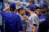 Los Angeles Dodgers' Julio Urias, second from left, is congratulated by teammates after he scored on a single by Matt Beaty during the fifth inning of a baseball game against the Miami Marlins, Thursday, July 8, 2021, in Miami. (AP Photo/Wilfredo Lee)