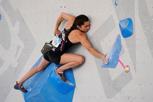 FILE - United States' Kyra Condie climbs during women's boulder qualification at the climbing World Cup on May 21, 2021, in Salt Lake City. Kyra Condie was told she needed back surgery to fix a severe curvature in her spine and would never be able to climb again. She did have surgery, after getting a second opinion, and has willed herself into becoming one of the world’s elite climbers despite having 10 vertebrae fused together. (AP Photo/Rick Bowmer, File)