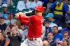 Philadelphia Phillies' Brad Miller watches his home run off Chicago Cubs starting pitcher Adbert Alzolay during the third inning of a baseball game Thursday, July 8, 2021, in Chicago. (AP Photo/Charles Rex Arbogast)
