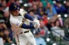Milwaukee Brewers' Avisail Garcia hits a two-run home run during the eighth inning of the team's baseball game against the Cincinnati Reds on Thursday, July 8, 2021, in Milwaukee. (AP Photo/Aaron Gash)