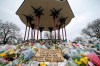 FILE - In this Saturday, March 20, 2021 file photo, floral tributes and messages are placed at the bandstand on Clapham Common in London in memory of Sarah Everard. A British police officer has pleaded guilty to murdering Everard, who was abducted as she walked home from a friend’s house in London. Wayne Couzens had previously admitted kidnapping and raping Everard. He entered a guilty plea to murder during a hearing on Friday, July 9. (AP Photo/Alberto Pezzali, file)