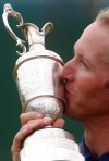 FILE - In this July 22, 2001, file photo, David Duval kisses the Claret Jug after winning the British Open Golf Championship at Royal Lytham and St. Anne's golf course in England. It is the 20-year anniversary of Duval's only major. (AP Photo/Adam Butler, File)