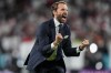 England's manager Gareth Southgate celebrates after winning the Euro 2020 soccer championship semifinal match against Denmark at Wembley stadium in London, Wednesday, July 7, 2021. (AP Photo/Frank Augstein, Pool)
