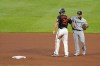 Baltimore Orioles' Anthony Santander (25) talks with Chicago White Sox second baseman Leury Garcia near second base during the fourth inning of a baseball game, Friday, July 9, 2021, in Baltimore. Officials reviewed a ball hit by Santander, which was initially ruled a home run, and overturned it into a ground rule double. (AP Photo/Julio Cortez)