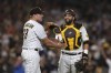 San Diego Padres relief pitcher Mark Melancon, left, celebrates with catcher Webster Rivas after the Padres defeated the Colorado Rockies 4-2 in a baseball game Friday, July 9, 2021, in San Diego. (AP Photo/Derrick Tuskan)