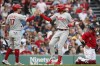 Philadelphia Phillies' Alec Bohm, center, celebrates his two-run home run that also drove in Rhys Hoskins (17) as Boston Red Sox's Christian Vazquez, right, kneels at home plate during the second inning of a baseball game, Saturday, July 10, 2021, in Boston. (AP Photo/Michael Dwyer)