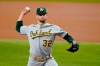 Oakland Athletics starting pitcher James Kaprielian throws to the Texas Rangers in the first inning of a baseball game in Arlington, Texas, Saturday, July 10, 2021. (AP Photo/Tony Gutierrez)