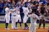 Los Angeles Dodgers' Mookie Betts, third from right, is congratulated by Matt Beaty, left, Austin Barnes, second from left, and AJ Pollock, third from left, after hitting a grand slam as Arizona Diamondbacks starting pitcher Alex Young, second from right, watches along with catcher Bryan Holaday during the seventh inning of a baseball game Saturday, July 10, 2021, in Los Angeles. (AP Photo/Mark J. Terrill)