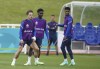 England's Jack Grealish, Bukayo Saka and Marcus Rashford, from left, during a training session at St George's Park, Burton upon Trent, England, Saturday July 10, 2021, ahead of their Euro 2020 soccer championship final match against Italy at Wembley Stadium on Sunday. (AP Photo/Dave Thompson)