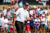 Bubba Watson pumps his fist as he makes a birdie putt on the 18th green during the final round of the Rocket Mortgage Classic golf tournament, Sunday, July 4, 2021, at the Detroit Golf Club in Detroit. (AP Photo/Carlos Osorio)