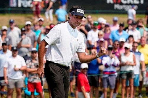 Bubba Watson pumps his fist as he makes a birdie putt on the 18th green during the final round of the Rocket Mortgage Classic golf tournament, Sunday, July 4, 2021, at the Detroit Golf Club in Detroit. (AP Photo/Carlos Osorio)