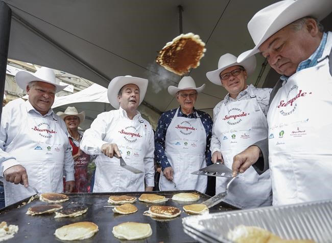 Alberta Premier Jason Kenney, second left, hosts a Stampede breakfast with visiting premiers, left to right, Doug Ford, of Ontario, Blaine Higgs, of New Brunswick, Scott Moe, of Saskatchewan, and Robert McLeod, of the Northwest Territories,in Calgary on July 8, 2019.THE CANADIAN PRESS/Jeff McIntosh