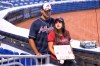 Khaled and Christine Taha hold a sign reading Prayers for Acuna as they wait to get autographs next to the Atlanta Braves dugout before a baseball game against the Miami Marlins, Sunday, July 11, 2021, in Miami. Atlanta Braves right fielder Ronald Acuna Jr. will undergo season-ending surgery after suffering a complete tear of the ACL in his right knee during Atlanta's 5-4 win over the Miami Marlins on Saturday. (AP Photo/Lynne Sladky)