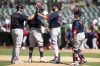 Boston Red Sox pitcher Matt Barnes (32) and teammates first baseman Bobby Dalbec (29), third baseman Rafael Devers (11) and catcher Christian Vázquez (7) celebrate their 1-0 victory over the Oakland Athletics in a baseball game, Sunday, July 4, 2021, in Oakland, Calif. (AP Photo/D. Ross Cameron)