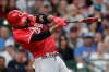 Cincinnati Reds' Nick Castellanos hits a two-run single during the ninth inning of a baseball game against the Milwaukee Brewers Sunday, July 11, 2021, in Milwaukee. (AP Photo/Aaron Gash)