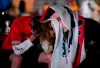 England supporters react in the designated fan zone at Trafalgar Square in London, Sunday, July 11, 2021, after Italy won the Euro 2020 soccer championship final match between England and Italy played at Wembley Stadium. (AP Photo/Matt Dunham)