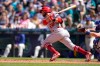 Los Angeles Angels' David Fletcher hits an RBI single in the seventh inning of a baseball game against the Seattle Mariners, Sunday, July 11, 2021, in Seattle. (AP Photo/Ted S. Warren)