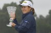 Nasa Hataoka, of Japan, holds the championship trophy after winning the Marathon Classic LPGA golf tournament at Highland Meadows Golf Club in Sylvania, Ohio, Sunday, July 11, 2021, in Sylvania, Ohio. The fourth round was cut short due to rain and poor course conditions. (AP Photo/David Dermer)