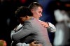 Number one overall pick Henry Davis, right, is embraced after being selected by Pittsburgh Pirates in the first round of the 2021 MLB baseball draft, Sunday, July 11, 2021, in Denver. (AP Photo/David Zalubowski)
