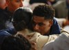 England's Marcus Rashford is embraced following their loss to Italy at the Euro 2020 soccer championship final at Wembley stadium in London, Sunday, July 11, 2021. (John Sibley/Pool Photo via AP)