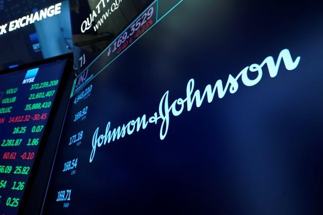 The Johnson & Johnson logo appears above a trading post on the floor of the New York Stock Exchange, Monday, July 12, 2021. Johnson & Johnson's COVID-19 vaccine may pose a