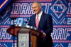 MLB Commissioner Rob Manfred reacts as he is booed by fans during the first round of the 2021 MLB baseball draft, Sunday, July 11, 2021, in Denver. (AP Photo/David Zalubowski)