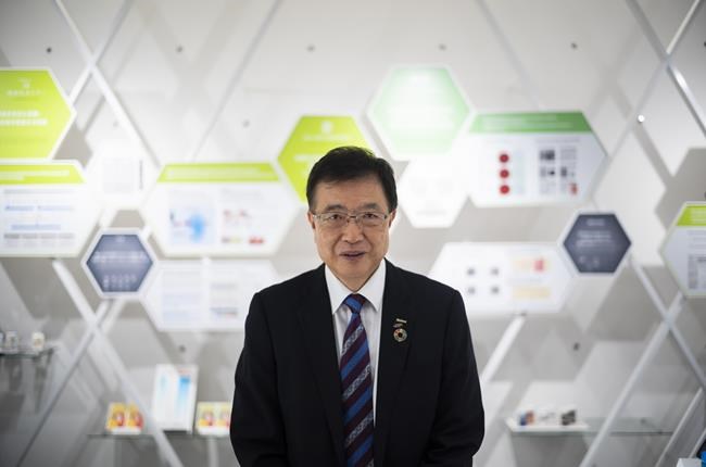 Takatoshi Ishikawa, executive vice president of FUJIFILM Holdings Corp., poses for a photo after an interview with The Associated Press at the company's office in Tokyo on June 11, 2021. Fujifilm outlived the decline of traditional photography and has logged record profits after diversifying into a wide range of businesses, from drugs and cosmetics to advanced materials, cameras and other types of imaging machines. (AP Photo/Hiro Komae)